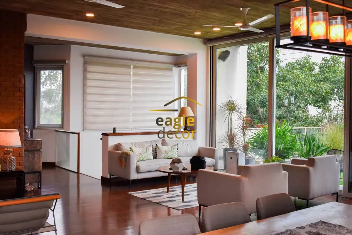 Luxury villa living room in Friends Colony with statement chandelier and curved seating