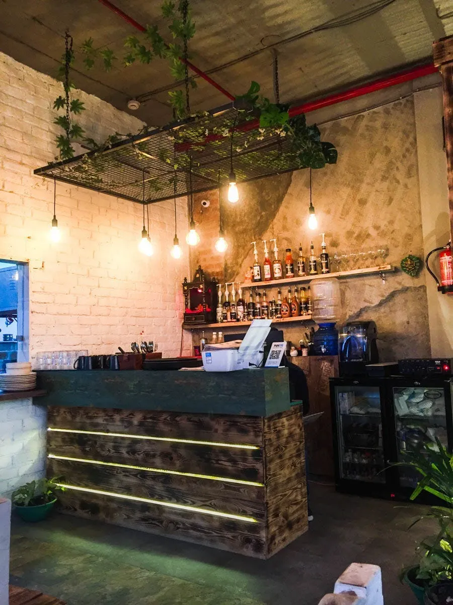 Noida cafe interior with vertical seating detail and textured finishes
