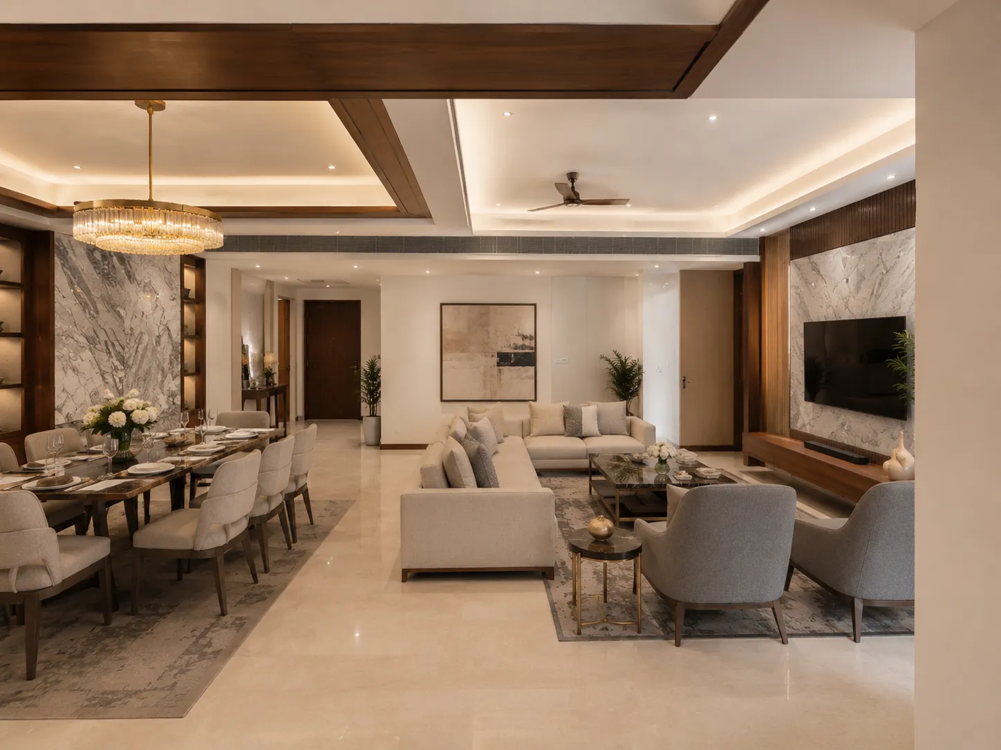 Wide view of a luxury living and dining space featuring marble wall cladding, a long marble-topped dining table, and a wooden ceiling detail.