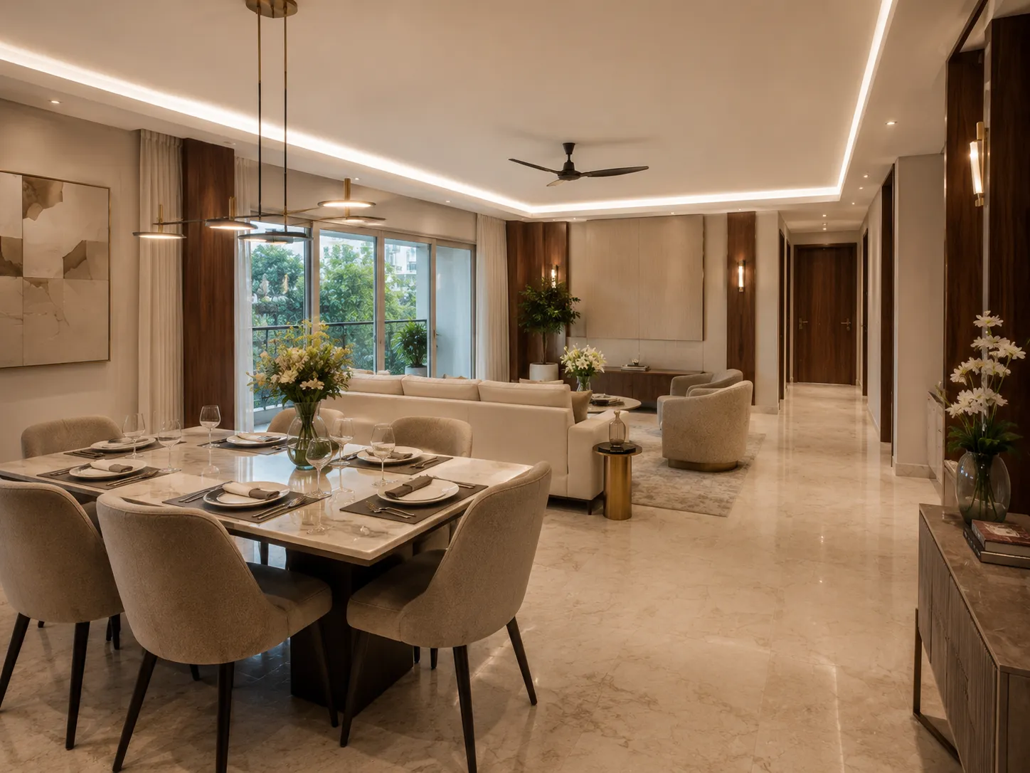 Dining area with a six-seater marble table, beige chairs, and a modern brass chandelier, seamlessly flowing into a living room with wood paneling.