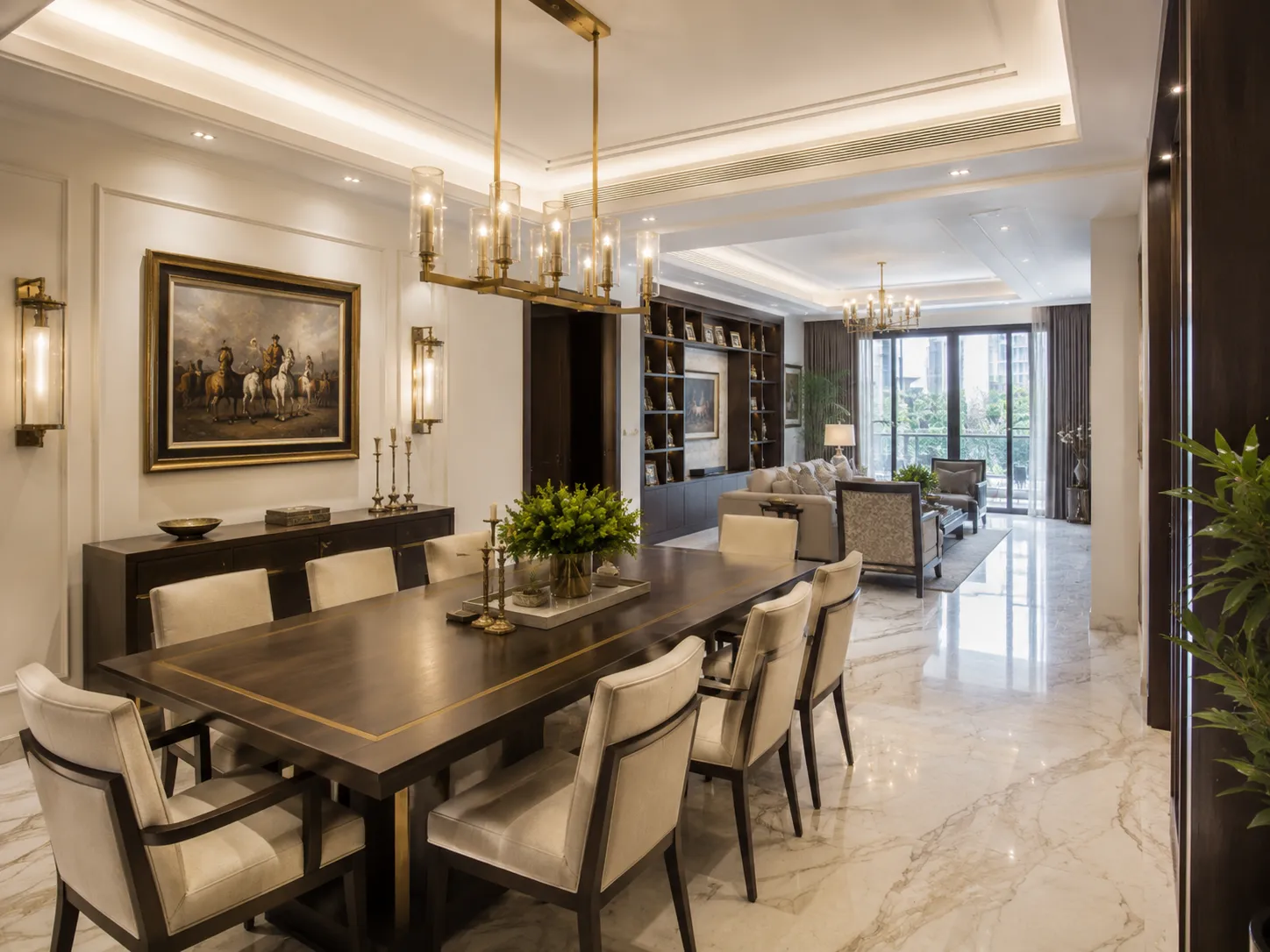 Elegant dining room featuring a dark wood table with brass inlay, upholstered chairs, a linear brass chandelier, and a large classical equestrian painting.